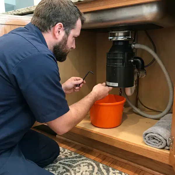 GVK Plumbing technician providing garbage disposal repair in Albuquerque, NM